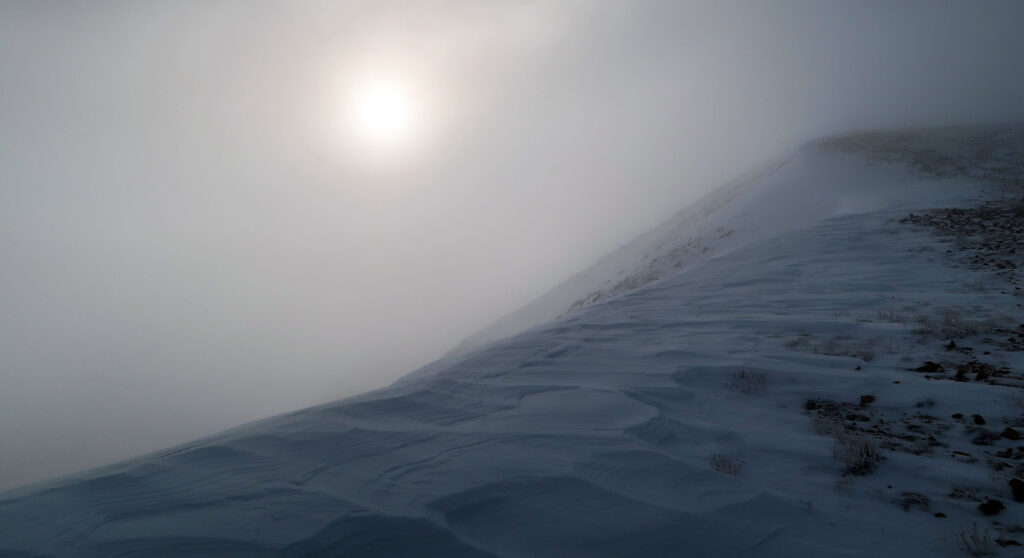 The Sun pokes through the clouds en route to Cupid Peak.