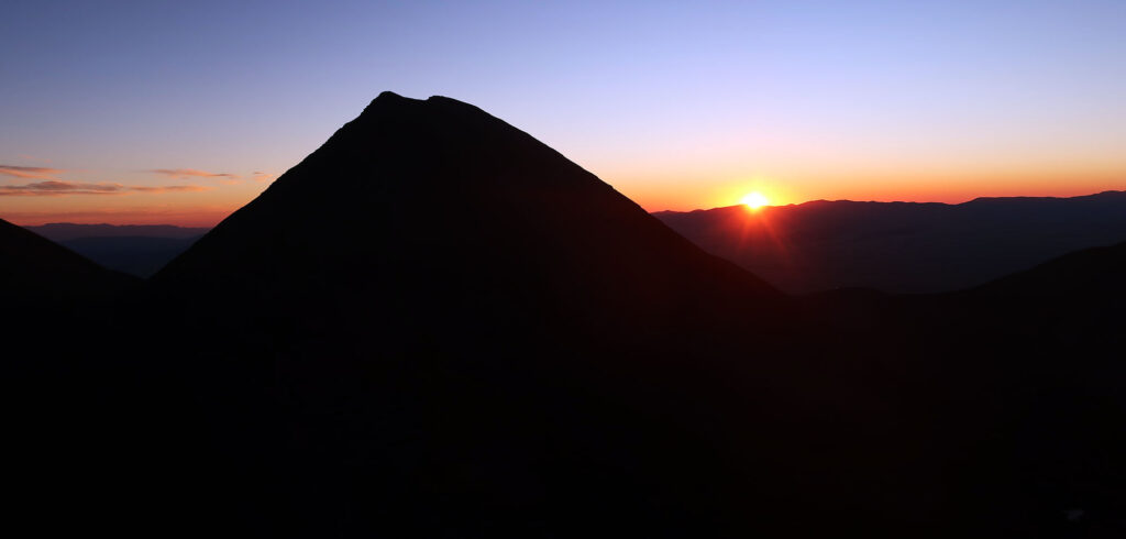 Sunrise seen from the Ellingwood Arete. Humboldt Peak rises in the foreground.