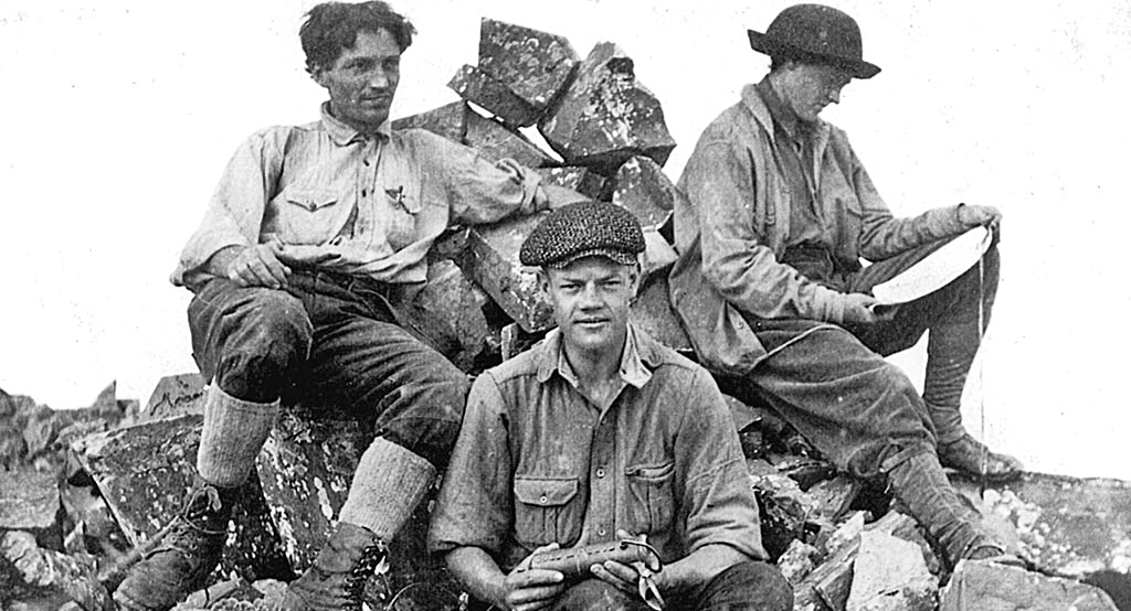 From Left to Right: Albert Ellingwood, Barton Hoag and Eleanor Davis sit atop Pyramid Peak.