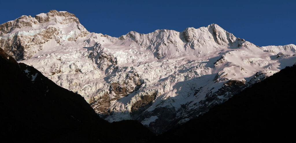 Cliff bands and ice falls cascade down the side of Mount Sefton, forming the Tuckett Glacier.