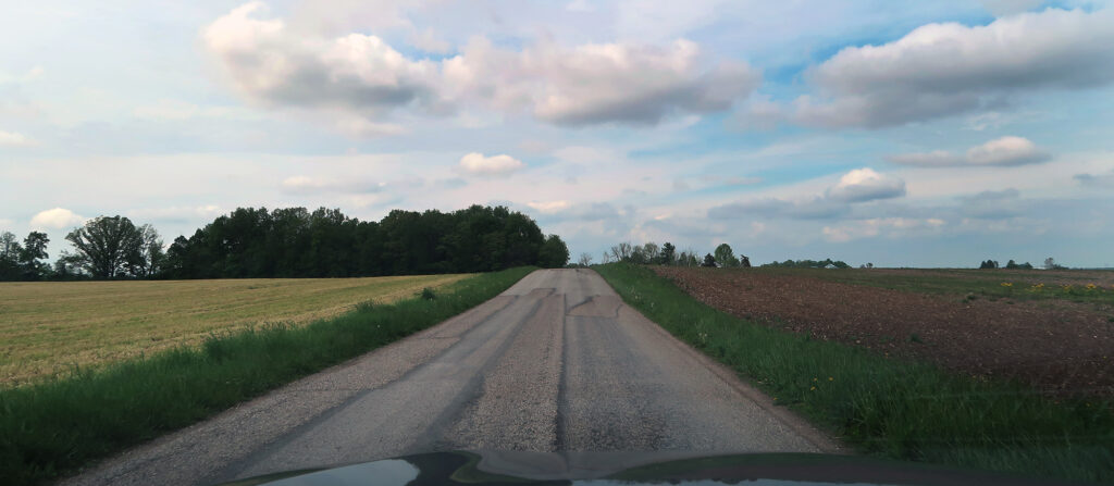 Hoosier Hill sits in the patch of trees on the left side of this roadway.