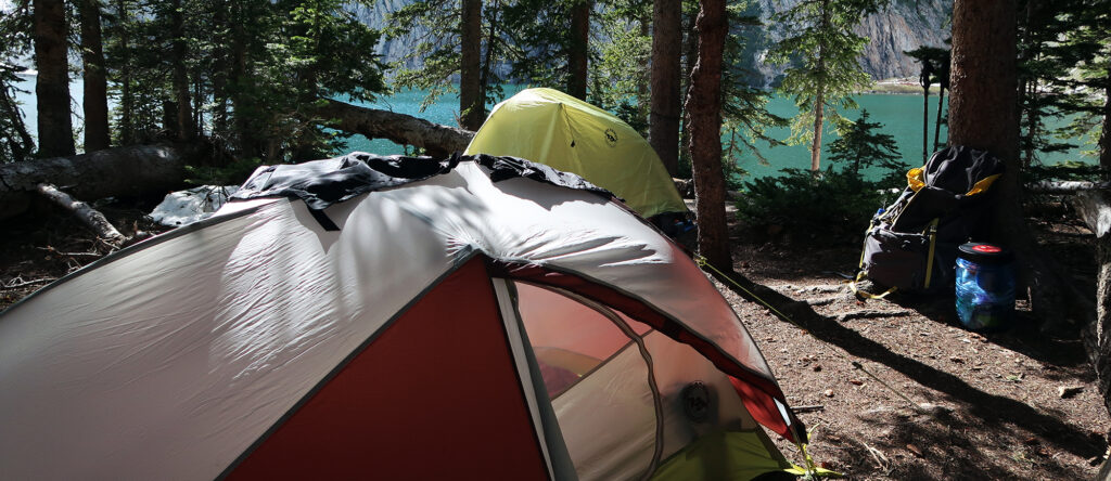 Setting up camp near the lake.