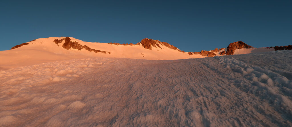 Alpenglow on the summit of Snowmass Mountain.