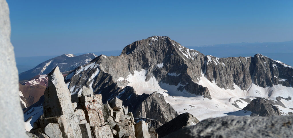 Capitol Peak looms in the distance from Snowmass's summit.