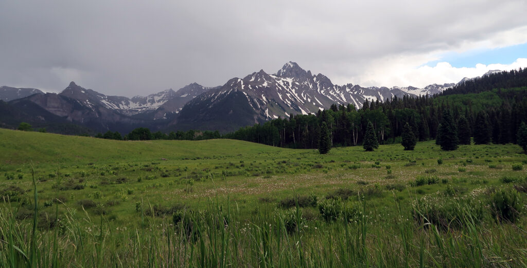 Mount Sneffels looms large amidst damp clouds.