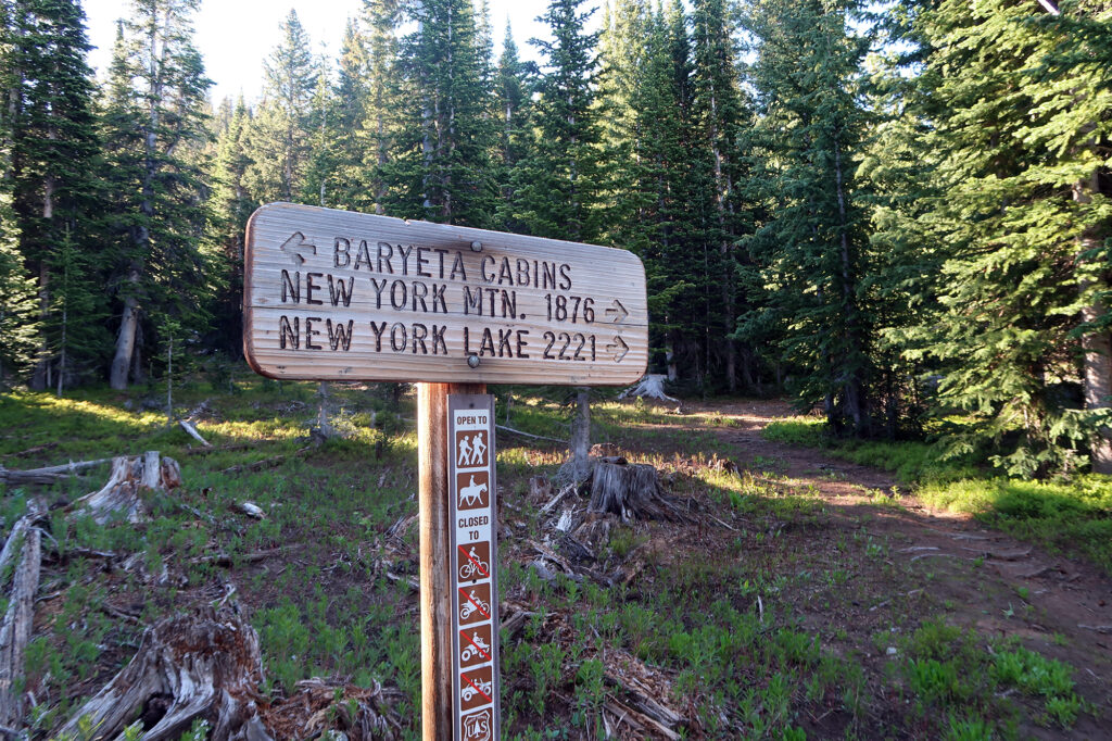 The upper trailhead, where the route turns back into single-track.