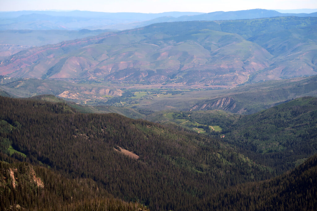The town of Edwards, and Interstate 70, hazy and distant, from the summit of New York Mountain.
