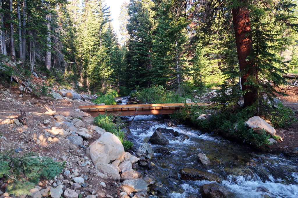 Crossing Crystal Creek via a cute wooden bridge.