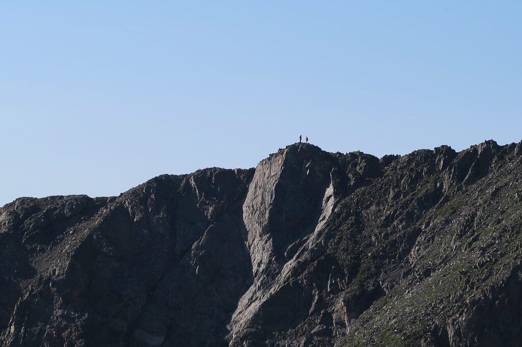 Scramblers on the nearby ridge between Mt Helen and Father Dyer.