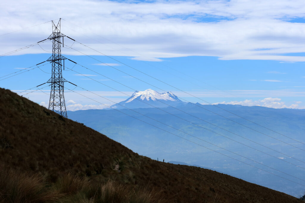 Transmission lines near 14,000 feet, with Antisana in the background.