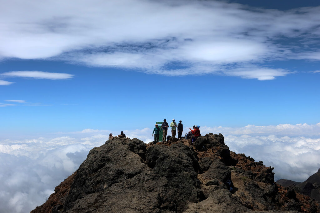 Our group atop Ruku Pichincha's summit, with clouds beyond to the West.