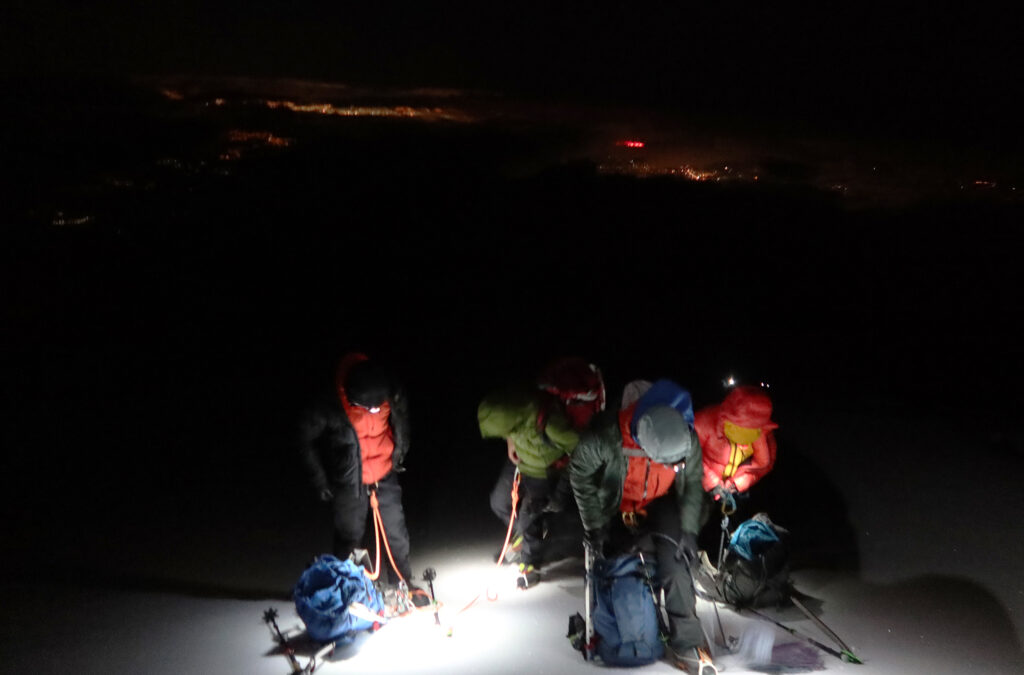 Stopping for a break early on after reaching Cayambe's glaciers. The eponymous city glows, far below, in the background.
