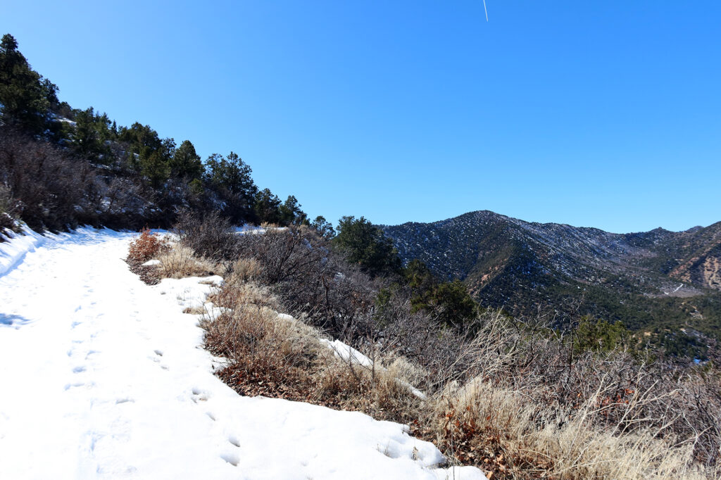 A snowy ascent midway up, with views of the Grand Hogback continuing beyond Harvey Gap.