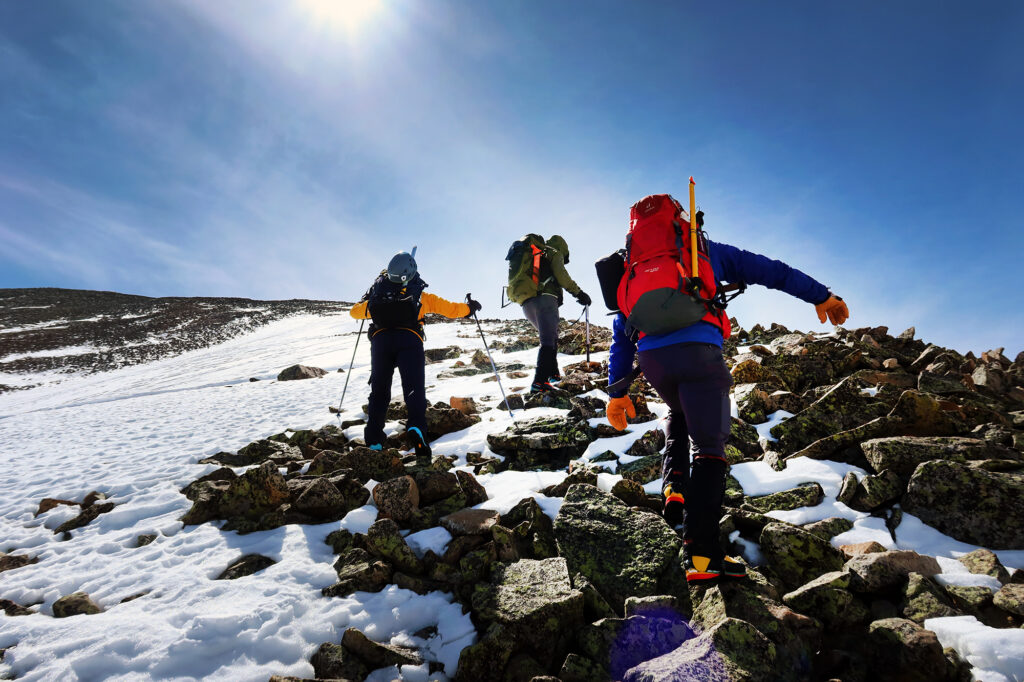 Heading up rocky, wind-swept upper slopes of Mount Guyot.