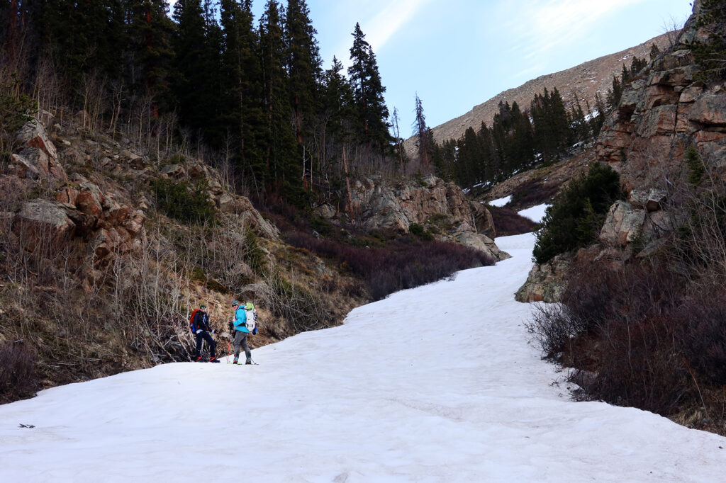 Getting geared up to ascend the lingering snow gulley up Lackawanna in Colorado's central Sawatch.