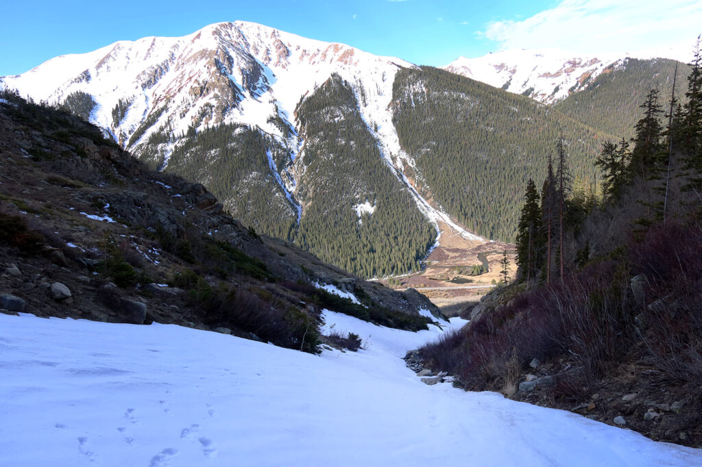 Views down the gulley, and across the narrow valley that harbors the route to Indy Pass.